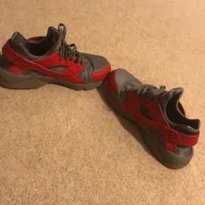 These are gray and red huraches by Nike